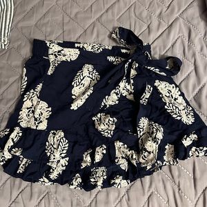 size medium, never worn, skort with wrap in the front